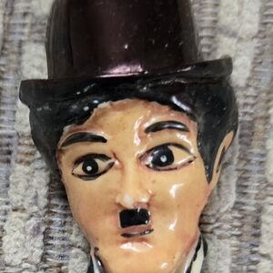 Charming Ceramic Figurine with Black Hat